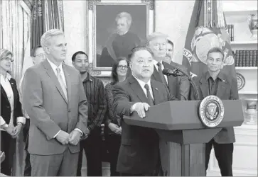  ?? Pool Getty Images ?? BROADCOM Chief Executive Hock Tan is shown with President Trump at the White House last week.