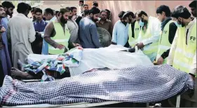  ?? AP ?? The bodies of the victims lie at a morgue in Sarghodha, Pakistan, on Sunday.