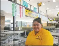  ?? The Associated Press ?? FOCUSED: Lorena Alaniz, a senior at Wisdom High School in Houston, sits in her campus cafeteria on Aug. 30, as she discusses the challenges she and her family faced after their home was flooded during Hurricane Harvey in 2017. Alaniz maintained a 3.5 GPA despite having to work part-time to help her family rebuild their flooded home. In the chaotic aftermath of Hurricane Harvey, Principal Jonathan Trinh feared the worst for his Houston high school, but Wisdom and other Houston schools defied expectatio­ns and showed improvemen­t in state scores, a feat attributed to perseveran­ce in the face of adversity, and changes to the state accountabi­lity ratings that put more emphasis on progress.