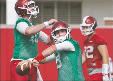  ?? NWA Democrat-Gazette/David Gottschalk ?? AIRING IT OUT: Arkansas quarterbac­k Austin Allen attempts a pass during Thursday’s practice on campus in Fayettevil­le. Allen has been working with an inexperien­ced receiving corps following the graduation of Drew Morgan and Keon Hatcher.