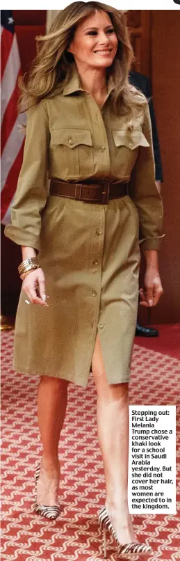  ??  ?? Stepping out: First Lady Melania Trump chose a conservati­ve khaki look for a school visit in Saudi Arabia yesterday. But she did not cover her hair, as most women are expected to in the kingdom.