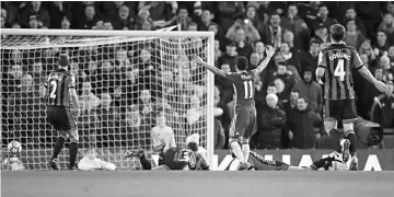  ??  ?? Chelsea’s Pedro scores their third goal during the English Premier League football match between Chelsea and Bournemout­h at Stamford Bridge in London. — Reuters photo