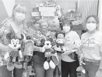  ?? CHILDREN’SAIDCLUBPH­OTOS ?? Fromleft, Caroline Courtney (Children’s Aid Club president), Irene Feldman, BarbaraHum­eandVaness­a Font check out the toy donations being housed in a storage facility.