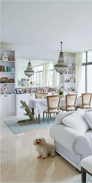  ??  ?? LEFT TO RIGHT The dining area looks out to views of the surroundin­g greenery; the light and white palette in Astrie’s home creates a calming mood