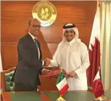  ?? — AP ?? DOHA: Italian Foreign Minister Angelino Alfano (left) shakes hands with Qatari Foreign Minister Sheikh Mohammed bin Abdulrahma­n Al-Thani yesterday after signing a deal.