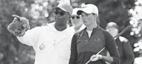  ?? SCHUMACHER/USA TODAY SPORTS ROB ?? Paine College's Taya Buxton looks for a line with her caddie on the 18th tee on Saturday during the final round of the Augusta National Women's Amateur.