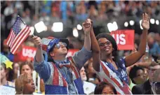  ?? JACK GRUBER, USA TODAY ?? Participan­ts decked out in red, white and blue soak in the moment on the convention floor.