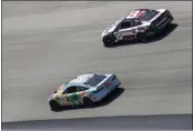  ?? TIM NWACHUKWU — GETTY IMAGES ?? Kyle Busch (18) and Corning’s Tyler Reddick (8) race during the NASCAR Cup Series DuraMAX Drydene 400at Dover Motor Speedway on Monday in Dover, Del.