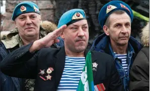  ?? AP/ALEXANDER ZEMLIANICH­ENKO ?? Veterans of the Soviet war in Afghanista­n join a memorial ceremony Friday in Moscow. What the Kremlin in 1989 branded “a political mistake” is now being reframed as justified as Russian President Vladimir Putin pushes an image of a strong Russia with an unblemishe­d past.