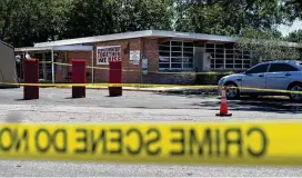  ?? JAE C. HONG / AP ?? Crime scene tape surrounds Robb Elementary School in Uvalde, Texas, on Wednesday. In the aftermath of the latest school shooting, districts around the U.S. have brought in more security and restricted visitors.