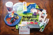  ??  ?? (Above) Brighter Birthday bags are all a little different, but most contain toys, treats, party supplies and basic toiletries. Items are donated by local individual­s and businesses. Brighter Birthdays is currently collecting items and donations for the...