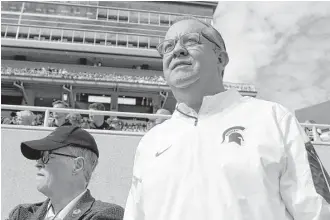  ?? Associated Press files ?? Michigan State athletic director Mark Hollis, right, could be in jeopardy as a result of the Larry Nassar abuse scandal. President Lou Anna Simon resigned Wednesday.