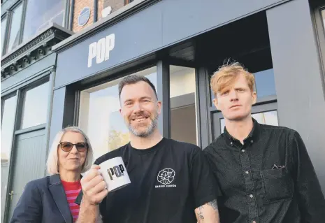  ?? ?? From left Pop Recs training and developmen­t manager Jo Gordon, Midnight Pizza Cru owner Dan Shannon and Pop Recs co-founder Michael McKnight.