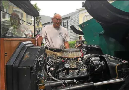  ?? PAUL KIRBY — DAILY FREEMAN ?? Art Cross looks at his replica 1914 Ford during the Fair Street Reformed Church’s sixth annual Classic Car Show on Saturday.
