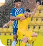  ??  ?? Killie’s Niko Hamalainen keeps tabs on Livi’s Steven Lawless