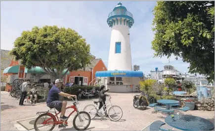  ?? Photograph­s by Luis Sinco Los Angeles Times ?? FISHERMAN’S VILLAGE is a beacon for day-trippers. Yes, the stretch of eateries and shops is kitschy, but therein lies the charm.