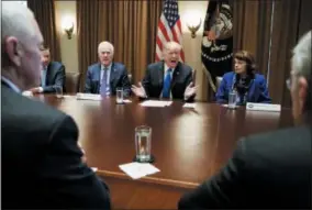  ?? CAROLYN KASTER — THE ASSOCIATED PRESS FILE ?? President Donald Trump speaks in the Cabinet Room of the White House, in Washington, during a recent meeting with members of congress to discuss school and community safety. With the president from left, Vice President Mike Pence, Sen. Chris Murphy,...