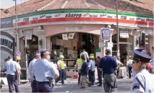  ?? (Reuters) ?? A GAPING hole is left in Sbarro pizzeria after a suicide bombing killed at least 18 people and wounded more than 80 others in Jerusalem in 2001.