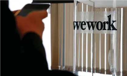  ?? Photograph: Bobby Yip/Reuters ?? Concerns over WeWork’s massive operating losses, pricey lease agreements and executive payouts have mounted in recent weeks.