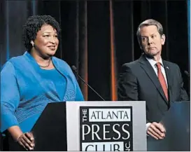  ?? JOHN BAZEMORE/AP ?? According to Georgia polls, Democratic gubernator­ial candidate Stacey Abrams is almost neck-and-neck with her Republican opponent, Secretary of State Brian Kemp.