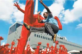  ?? BAMPFA photos ?? Luc Bendza soars in “The African Who Wanted to Fly,” a documentar­y about a martial artist from Gabon who became a martial arts master in China.