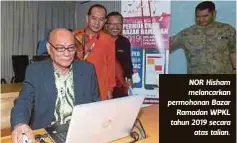  ??  ?? NOR Hisham melancarka­n permohonan Bazar
Ramadan WPKL tahun 2019 secara
atas talian.