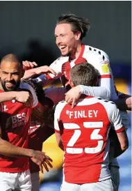  ??  ?? Barrie Mckay (top) celebrates scoring for Fleetwood.