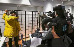  ?? — AFP ?? Protecting her identity: The actress speaking to reporters from behind a screen during a press conference in Seoul.
