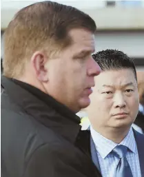  ?? STAFF FILE PHOTO BY MARK GARFINKEL ?? SAVING FACE AND HIS JOB? Tensions must be high between Mayor Martin J. Walsh and BPS Superinten­dent Tommy Chang after the start-time flap.