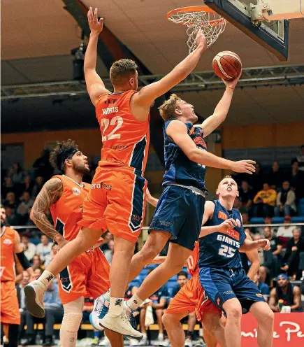  ?? CHRIS SYMES/PHOTOSPORT ?? Nelson Giants’ Daniel Grida goes for the basket against the Sharks at the Trafalgar Centre in Nelson. Southland won the match 100-91.