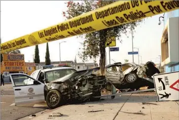  ?? Al Seib Los Angeles Times ?? IN 2015, TWO LAPD officers were hospitaliz­ed with minor injuries after their patrol car collided with a suspected stolen vehicle at the intersecti­on of Main Street and 98th Street in South Los Angeles.