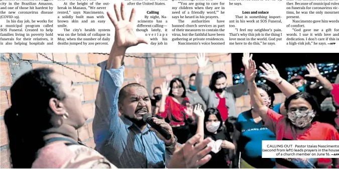  ?? —AFP ?? CALLING OUT Pastor Izaias Nascimento (second from left) leads prayers in the house of a church member on June 16.