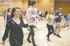  ?? STAFF PHOTO BY DOUG STRICKLAND ?? Contra dancing is done by couples in long lines who follow steps led by a caller. A contra dance is held monthly at Brainerd United Methodist Church.