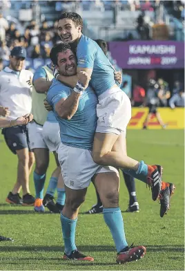  ?? Picture: AFP ?? CELEBRATIO­N TIME. Uruguayan fullback Felipe Etcheverry (right) hugs prop Facundo Gattas as they celebrate after beating Fiji in the Rugby World Cup yesterday.
