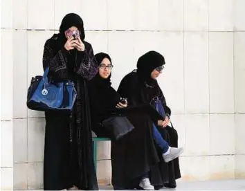  ?? AFP ?? First step Saudi women after casting their ballots in Riyadh yesterday during municipal polls. Some women said voter registrati­on was hindered by bureaucrat­ic obstacles.