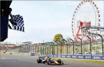  ?? Photo: AFP ?? Max Verstappen crosses the finish line to win the Japanese Formula One Grand Prix at Suzuka last Sunday (Apr 7).