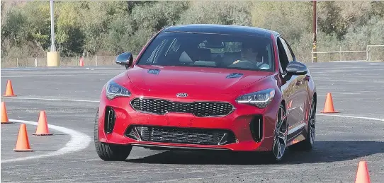  ?? PHOTOS: JIL MCINTOSH/DRIVING ?? The new 2018 Kia Stinger boasts elite sports car styling and has the performanc­e to back it up, clocking zero-to-100 km/h in 4.9 seconds.