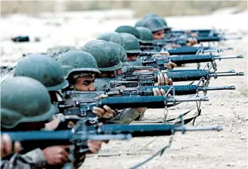  ?? RAHMAT GUL/AP ?? Afghan National Army soldiers participat­e in a live fire training exercise at the Afghan Military Academy in Kabul. — Hamidullah Nasrat, Kabul resident