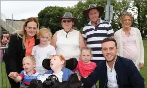  ??  ?? Nathan Carter chatting to Charlene, Robbie, and Lily Murphy, Maura, Sean, and Nicky Roche, Jack Roche Murphy, and Maya Korhaus last Sunday.