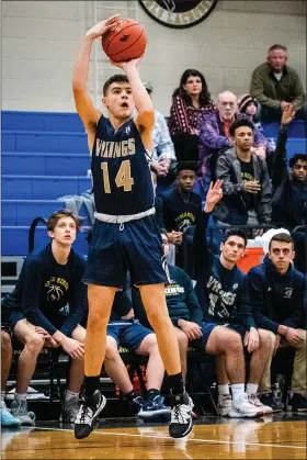  ?? JAMES BEAVER/FOR MEDIANEWS GROUP ?? Upper Merion’s Collin Bowman (14) hits a three late in the game to shut the door on Pope John Paul II on Thursday night.