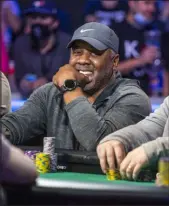  ?? L.E. Baskow Las Vegas Review-journal ?? George Holmes is guaranteed at least $1.8 million for fifth place out of the field of 6,650 in the Main Event at the World Series of Poker.