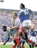  ??  ?? Battle Gus Caesar and Evan Balfour try to prevent a Mark Hateley header