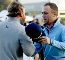  ?? Harry How/Getty Images ?? Justin Thomas, right, shot a 4-over 75 to lose the Genesis Open to J.B. Holmes, left, Sunday.