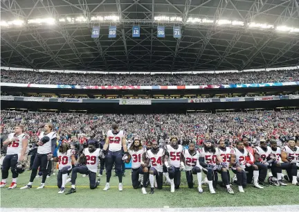  ?? ELAINE THOMPSON/THE ASSOCIATED PRESS ?? Owners have approved a policy that will allow the NFL to fine teams if a player protests during the anthem.