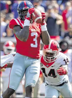  ?? BRANT SANDERLIN / BSANDERLIN@AJC.COM ?? Georgia cornerback Malkom Parrish allows a catch by Ole Miss’ Damore’ea Stringfell­ow. The Bulldogs struggled against Chad Kelly and the Rebels’ passing game.