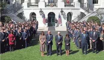  ?? PHOTOS BY CAROLYN KASTER, AP ?? President Trump and first lady Melania Trump stand with Vice President Pence and his wife, Karen, during a moment of silence for the shooting victims.