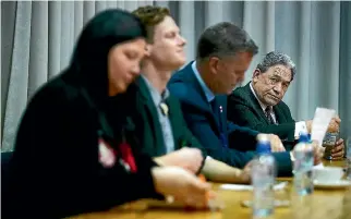  ??  ?? Winston Peters susses out his opposition Willow-Jean Prime, Ash Holwell and Matt King at a Northland campaign debate in Wellsford. His partner Jan Trotman waits outside in his car.