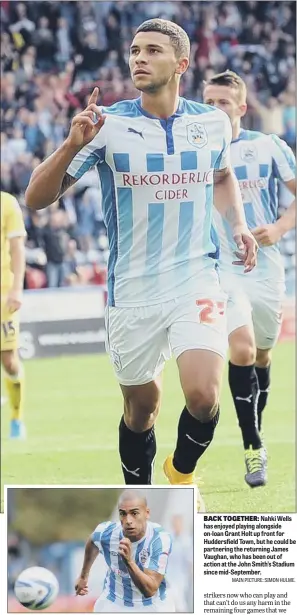  ?? MAIN PICTURE: SIMON HULME. ?? BACK TOGETHER: Nahki Wells has enjoyed playing alongside on-loan Grant Holt up front for Huddersfie­ld Town, but he could be partnering the returning James Vaughan, who has been out of action at the John Smith’s Stadium since mid-September.