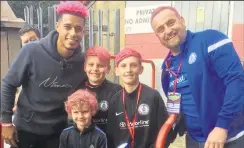  ??  ?? Dave Sharp and his sons Charlie, Tom and George with Charlton’s Lyle Taylor