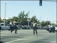  ?? JULIE DRAKE/VALLEY PRESS FILES ?? Los Angeles County Sheriff’s deputies block the intersecti­on of Lancaster Boulevard and Sierra Highway as they search for the person who shot a Sheriff’s deputy in the area in August. The shooting turned out to be a hoax, and the deputy involved has been arrested.